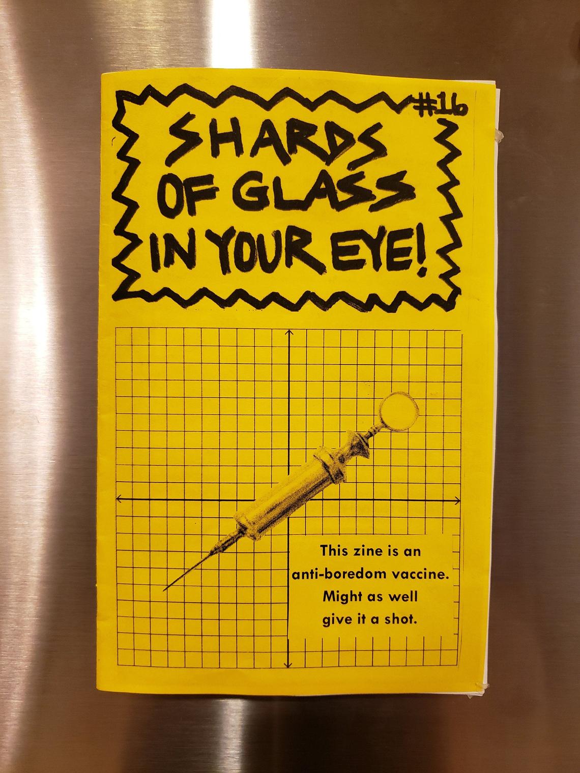 photo of zine: yellow cover, handwritten title, clip art syringe, "This zine is an anti-boredom vaccine. Might as well give it a shot."