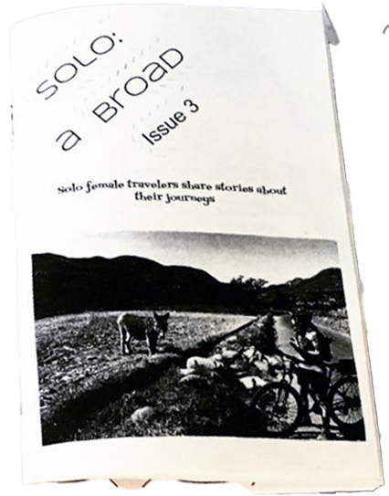 zine cover: black and white photo of a rural landscape with an animal and two people with bicycles