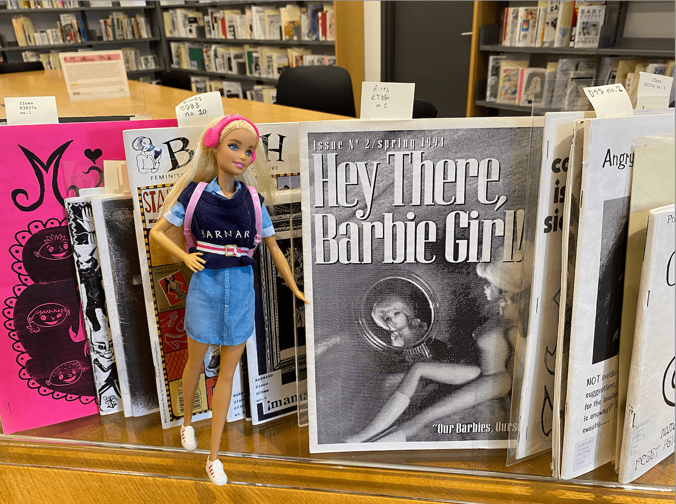 barnard barbie is reading 'Hey There, Barbie Girl'