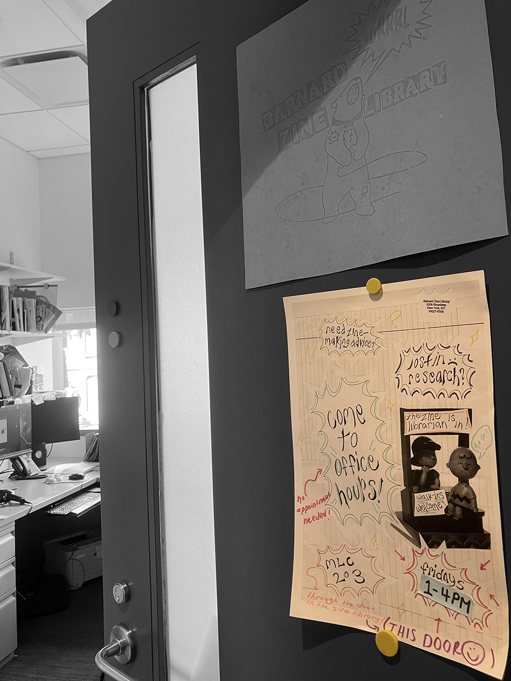 photo of an open door with an officer hours sign on it