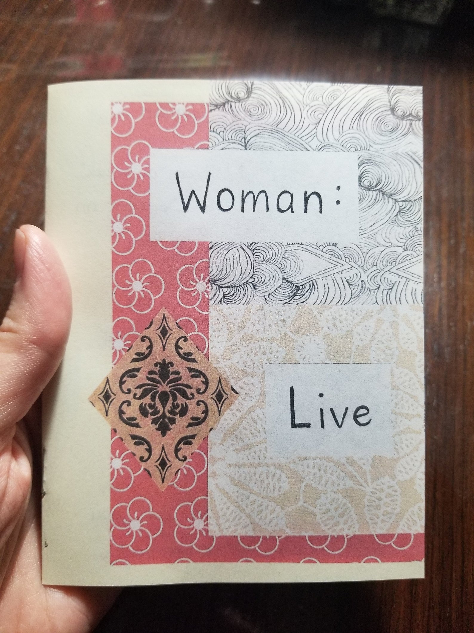 zine cover, "Woman: Live." collage of patterns with handwritten title