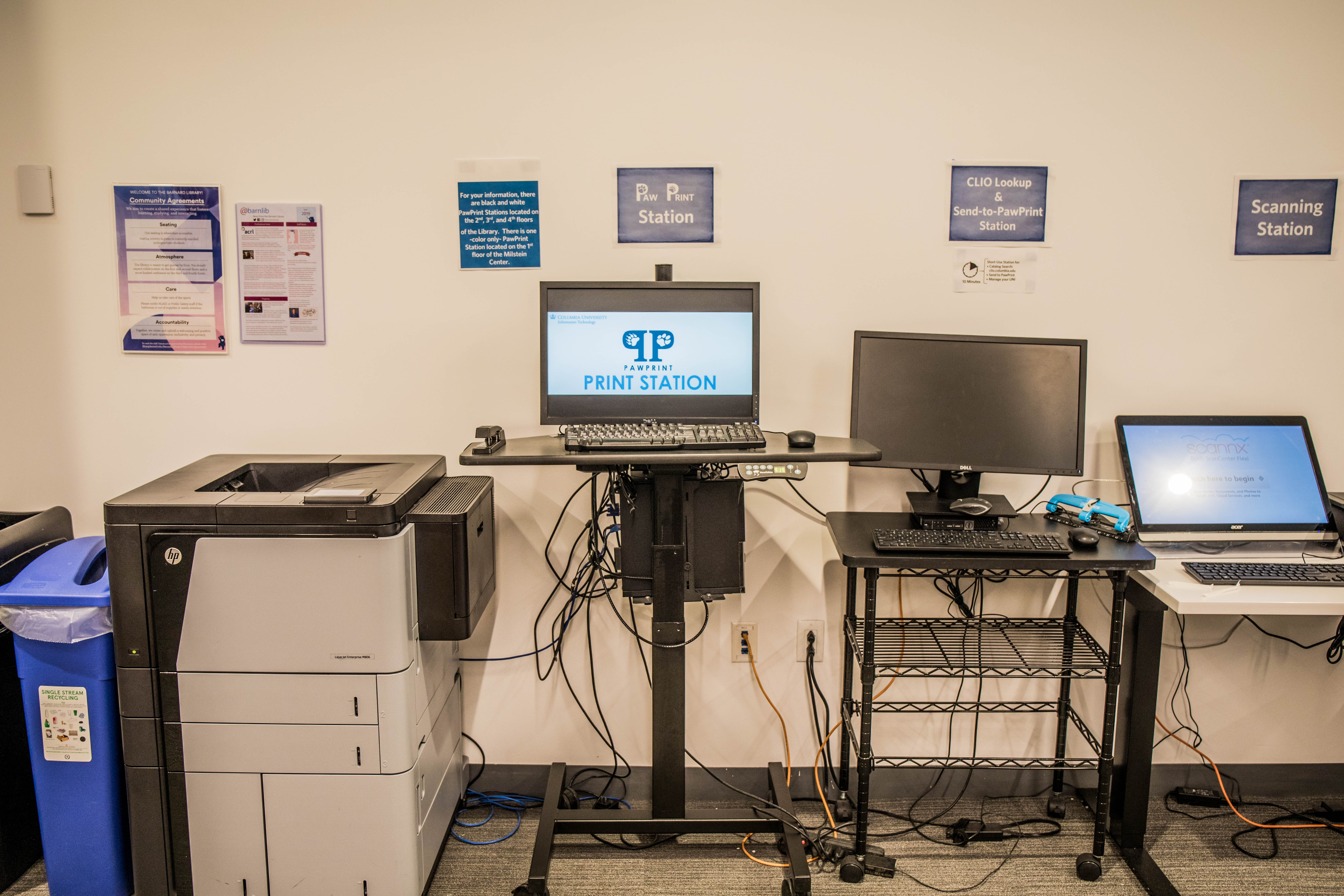 A printer, desktop, lookup station, and scanner on the third floor.