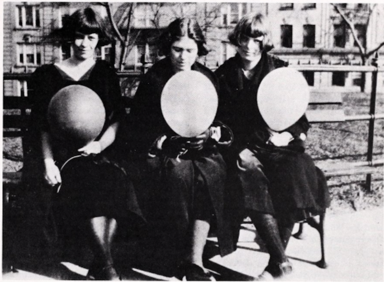 Three girls sitting on bench