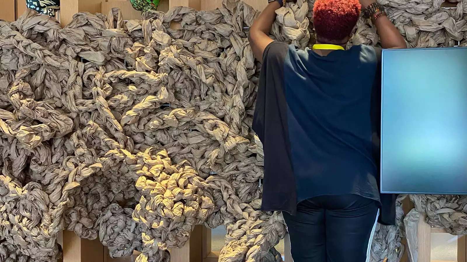 large braids of rope being installed on a wall