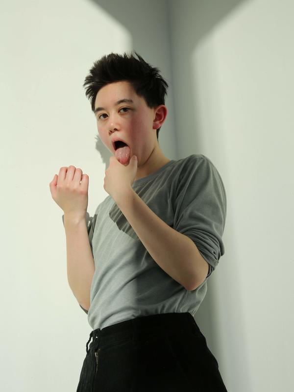 upper body photo of Noa Rui-Piin Weiss leaning back with his tongue out