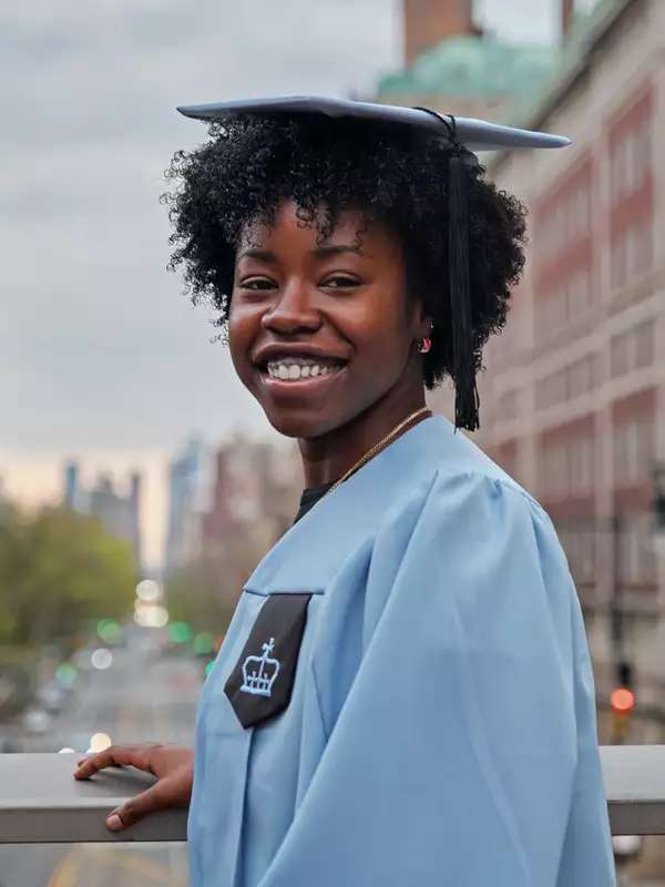 Jazmin Maço in light blue graduation cap and gown