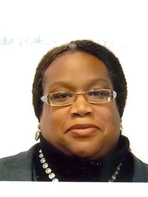 Woman with braids and glasses