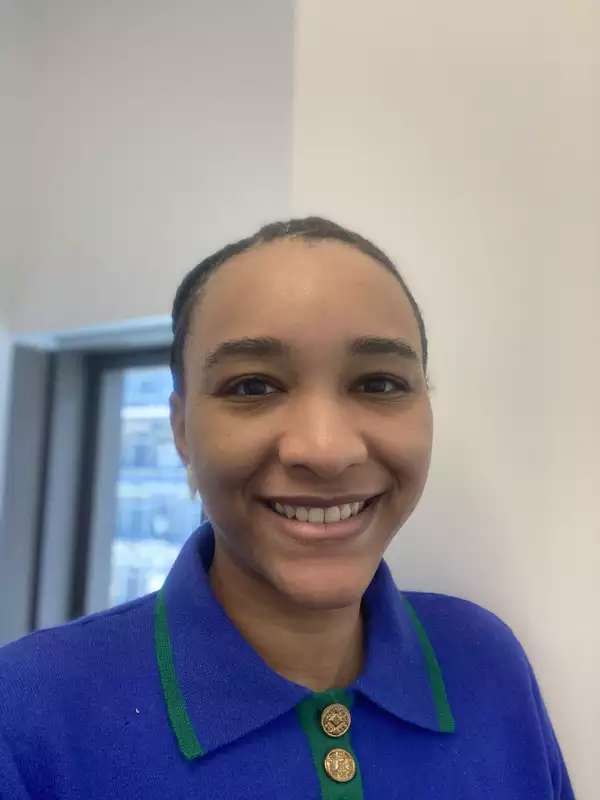 Woman wearing blue shirt with collar