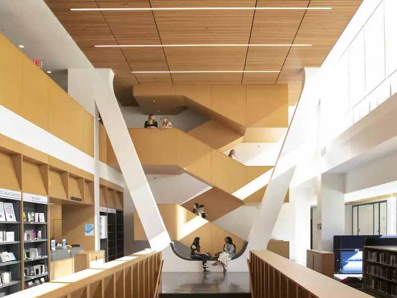 Students chatting on the second floor of the library